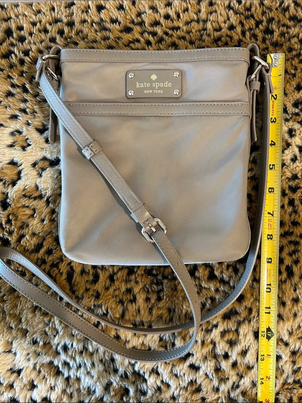 kate spade khaki-green crossbody bag with gold plaque